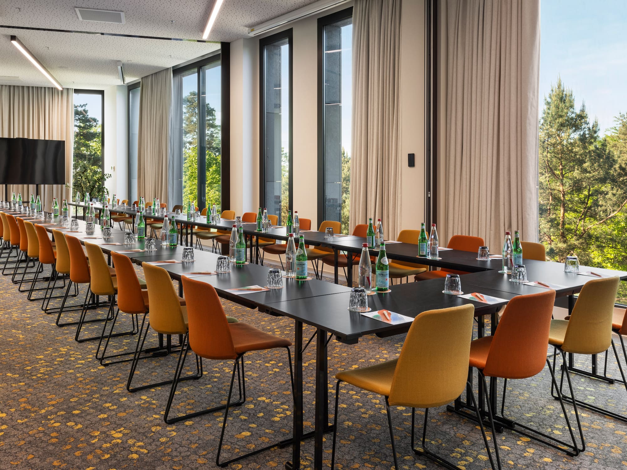 a long conference room with tables and chairs