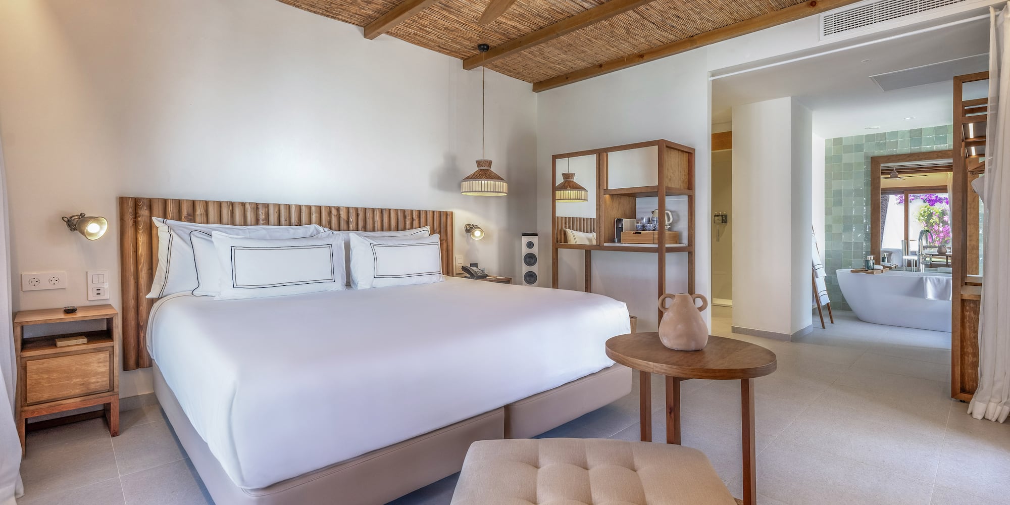 a room with a bed and a bathtub