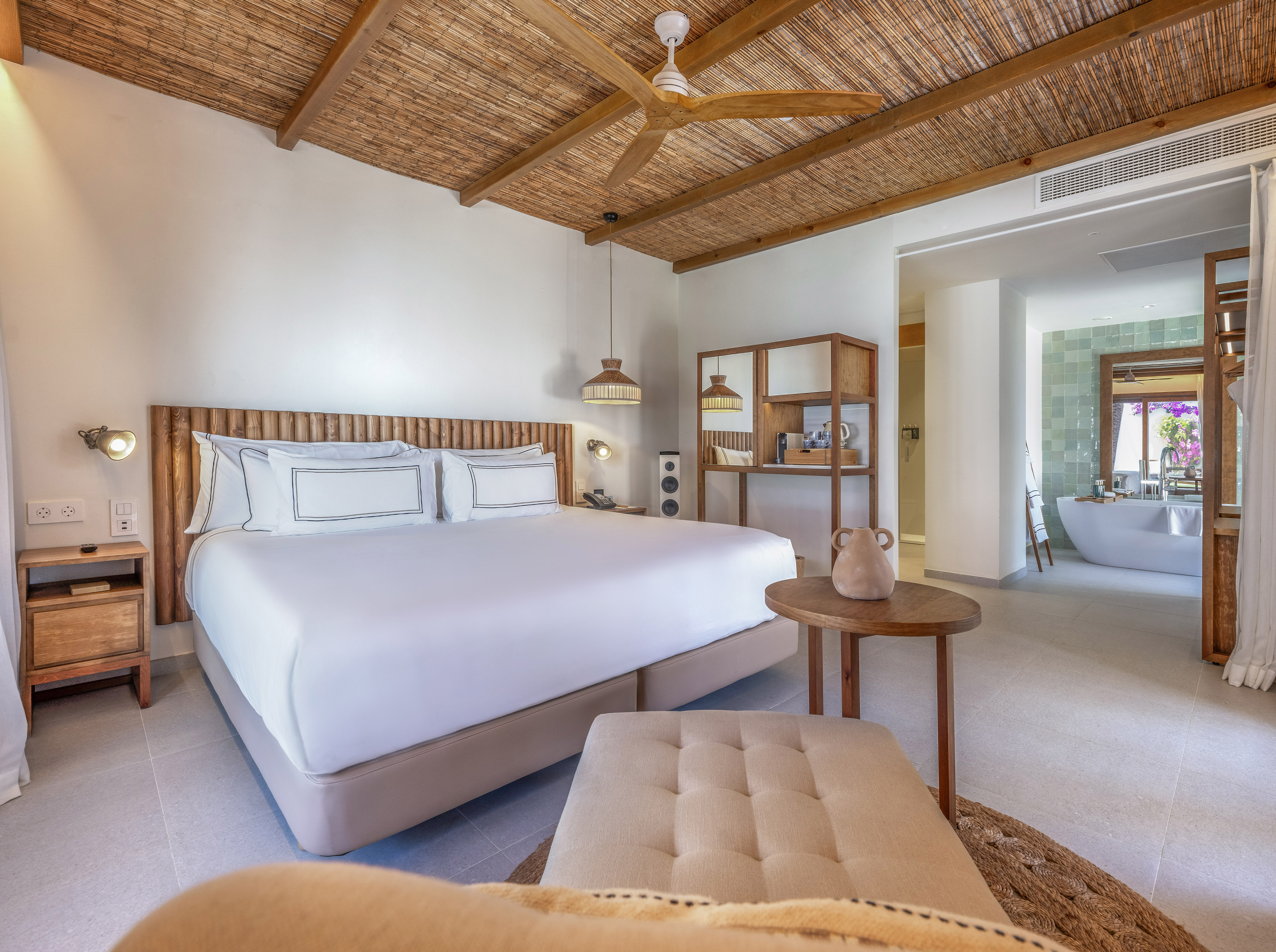 a room with a bed and a bathtub