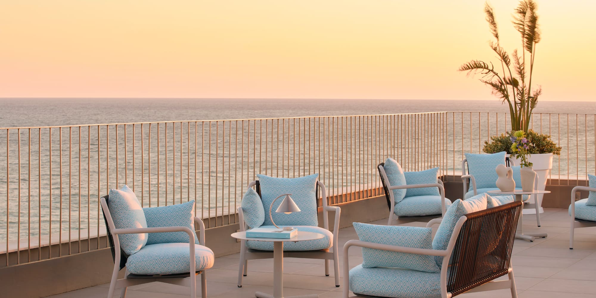 a patio with chairs and a table