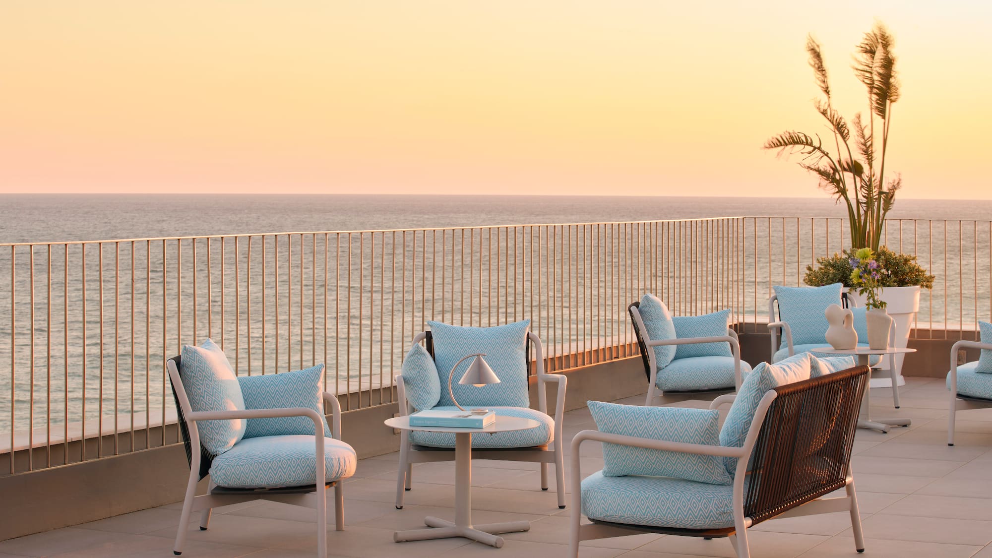 a patio with chairs and a table