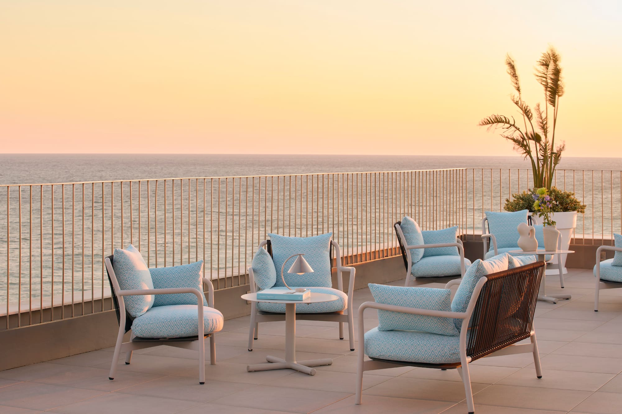 a patio with chairs and a table