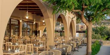 a restaurant with tables and chairs