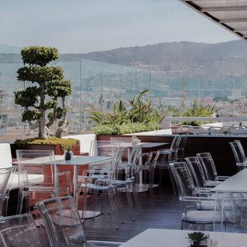 a restaurant with clear chairs and tables