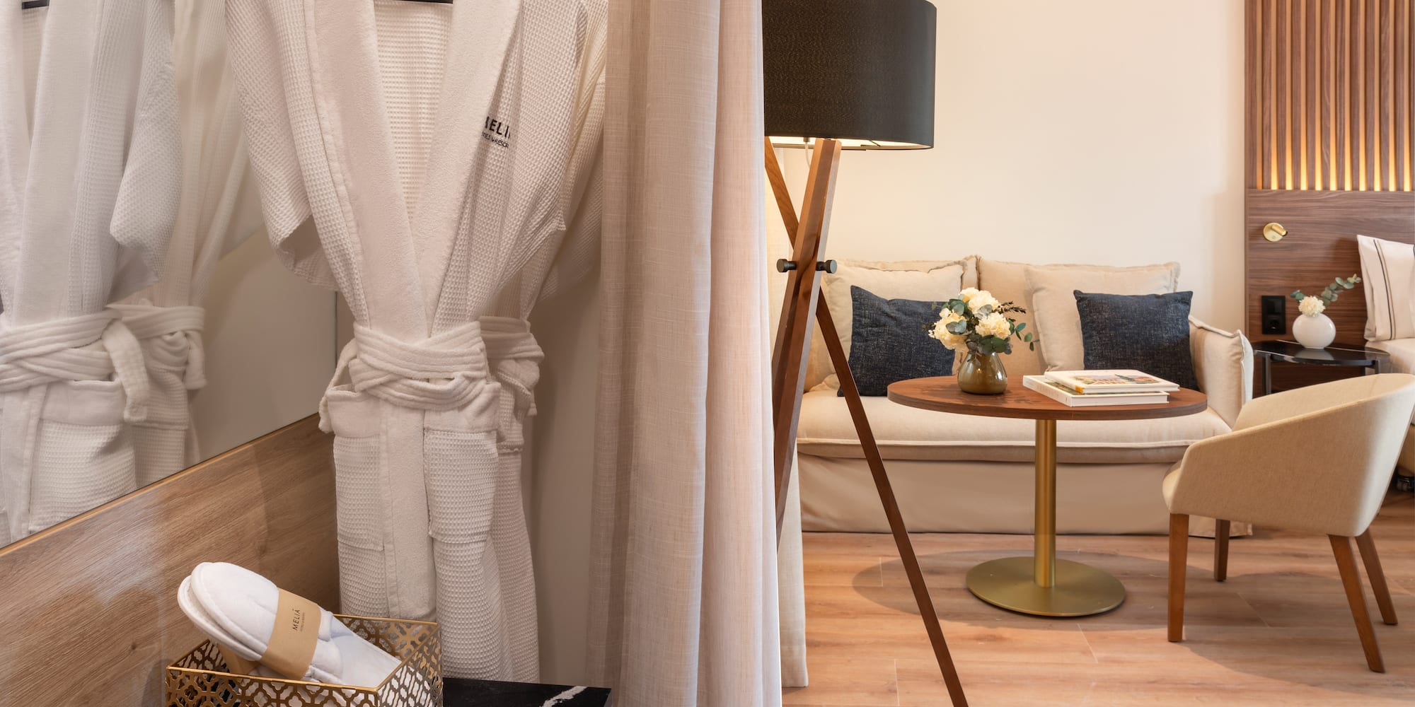 a room with a white robe and a table and a couch