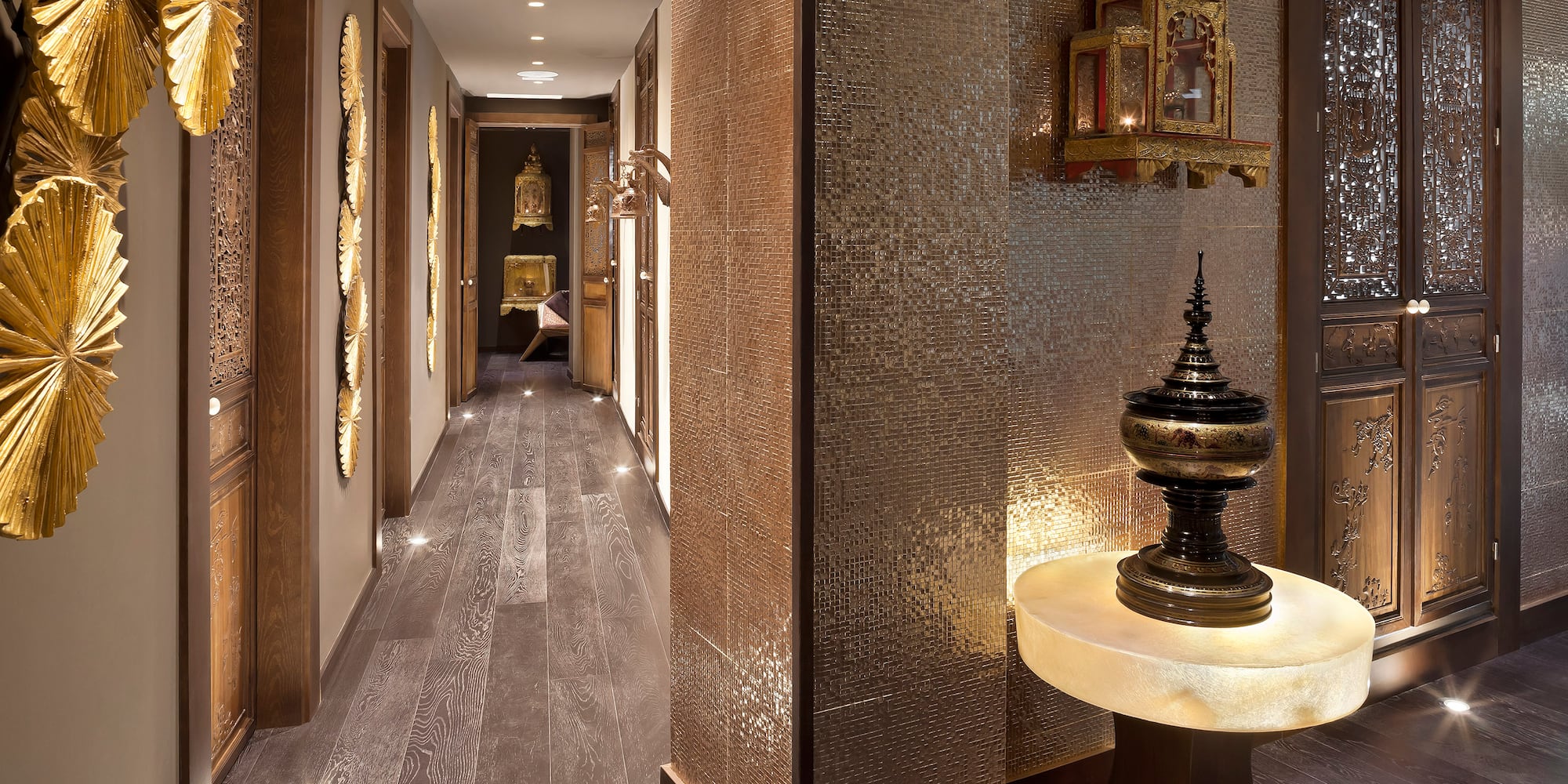 a hallway with a table and a mirror wall