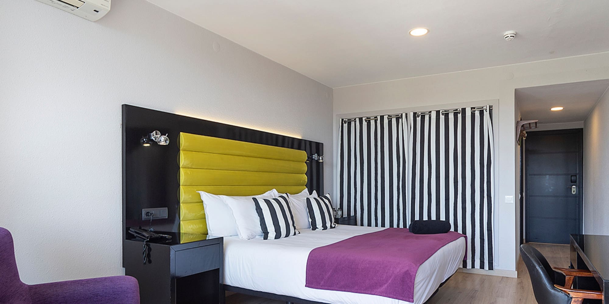 a room with a bed and a chair