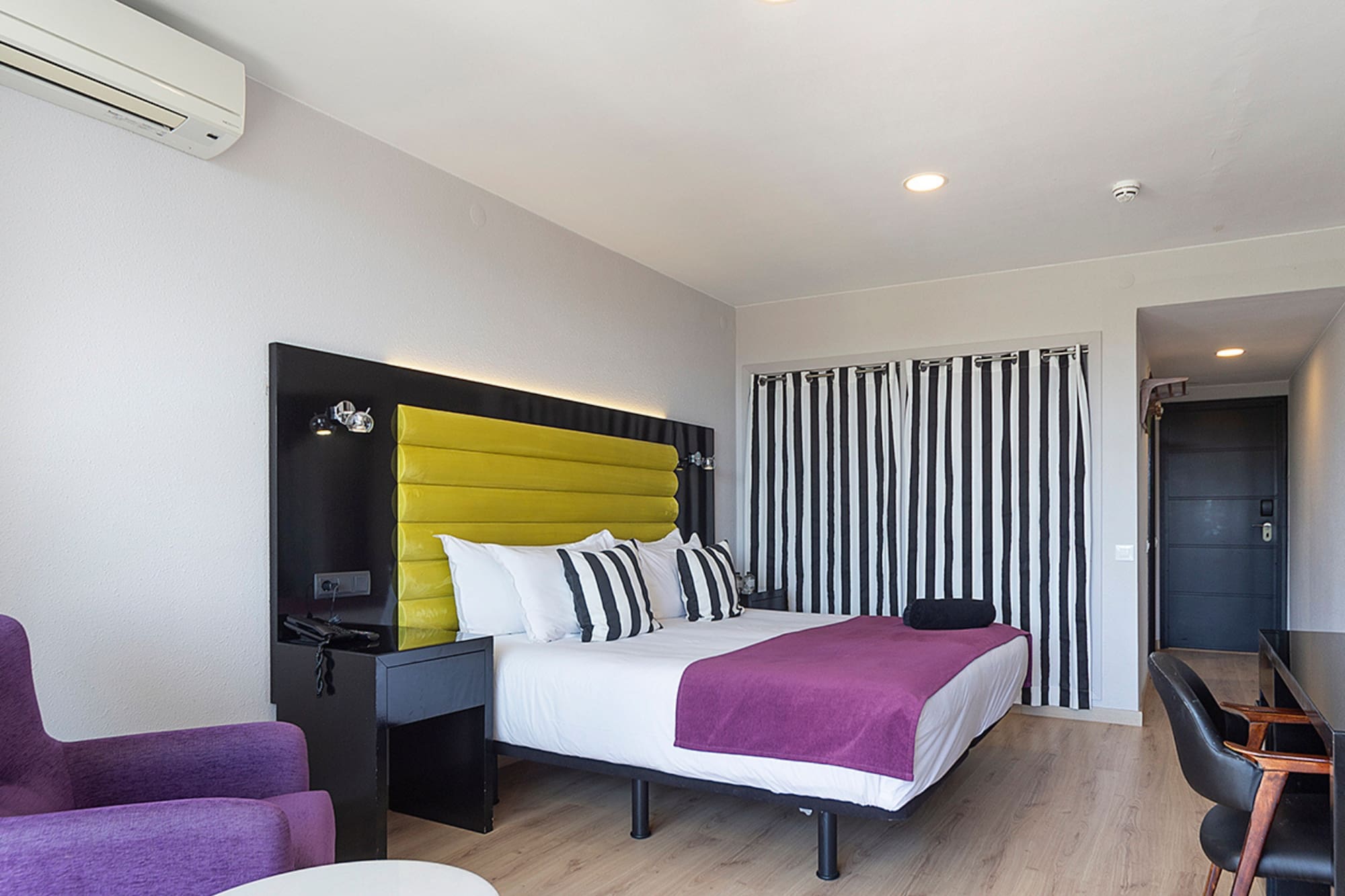 a room with a bed and a chair