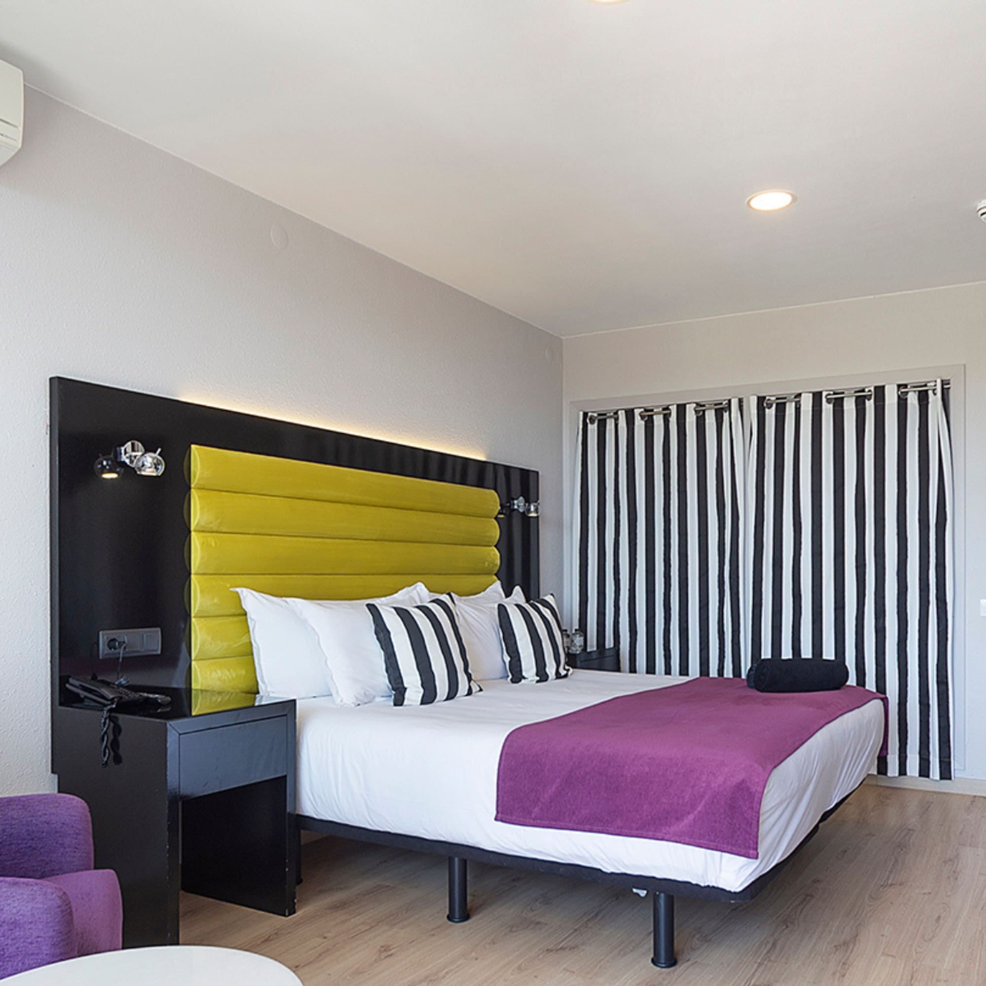 a room with a bed and a chair