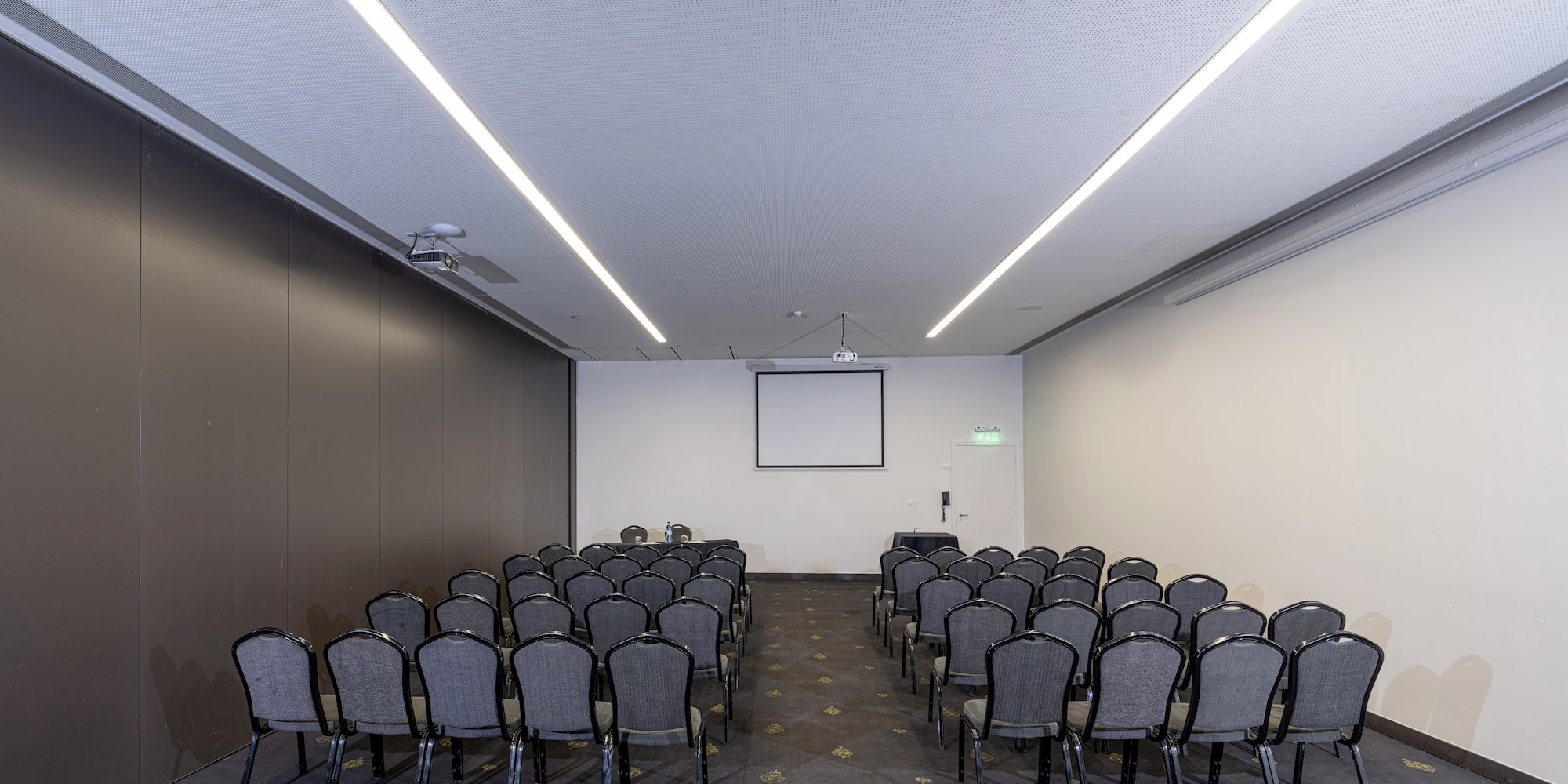 a room with rows of chairs