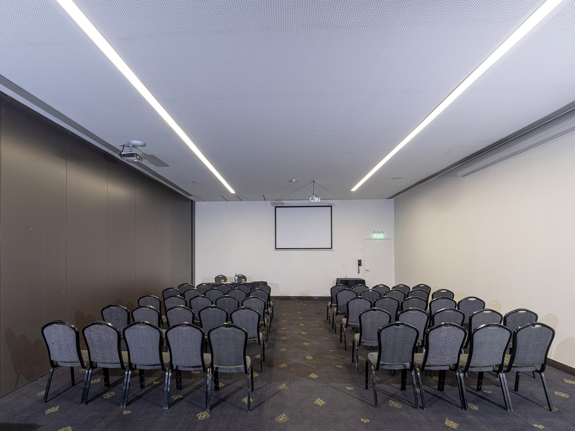 a room with rows of chairs