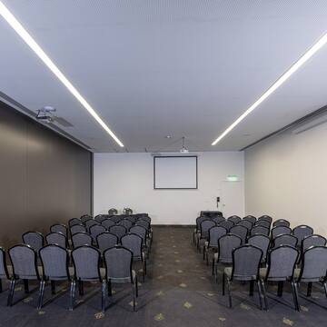 a room with rows of chairs