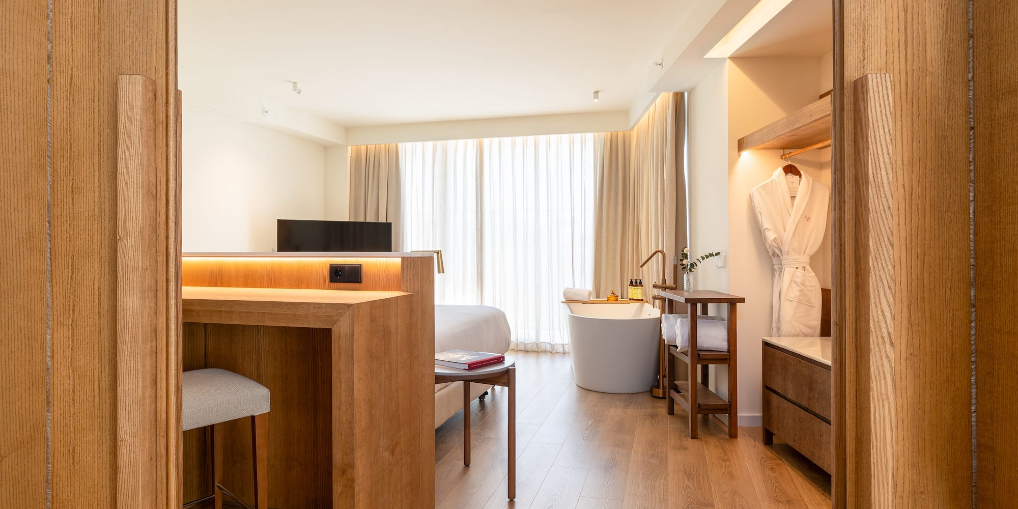 a room with a bed and a bathtub