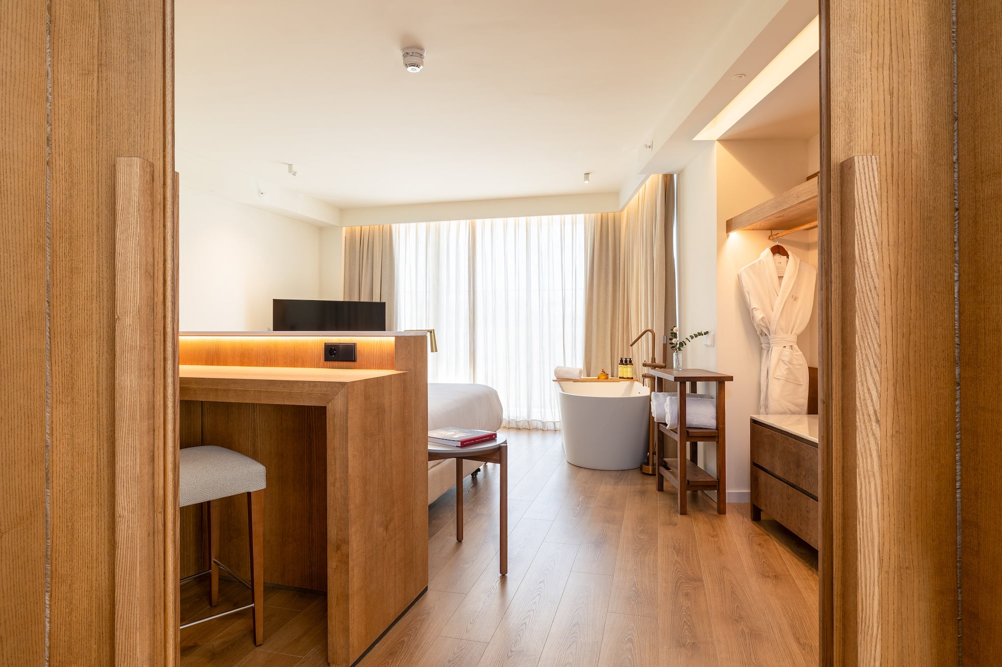 a room with a bed and a bathtub