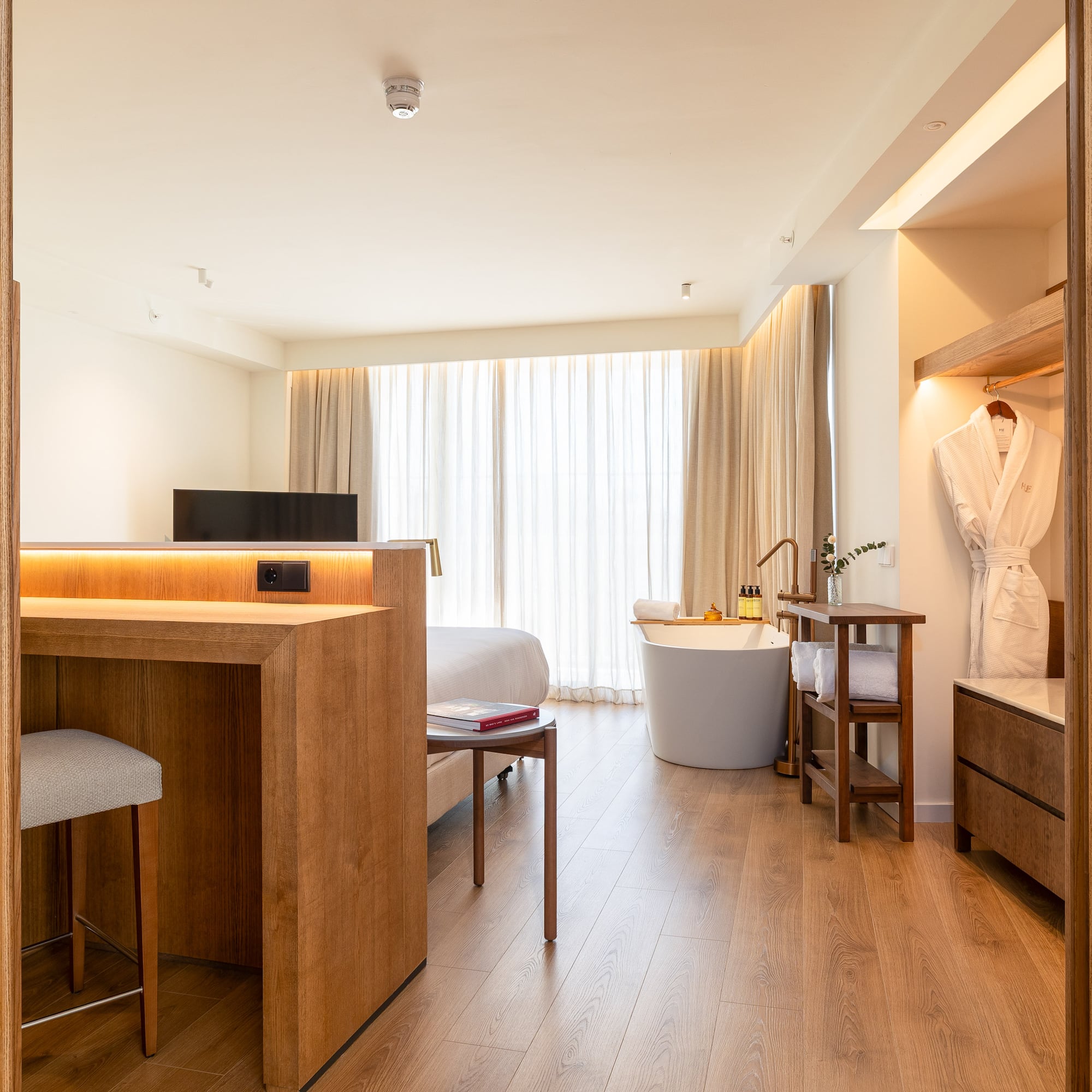 a room with a bed and a bathtub