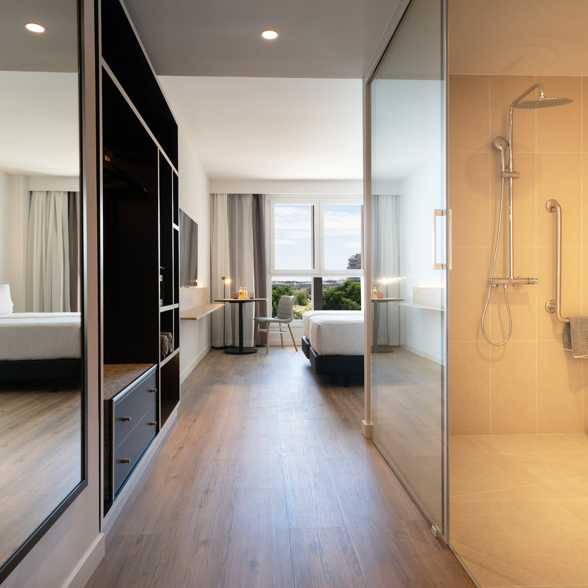 a bathroom with a shower and a bed