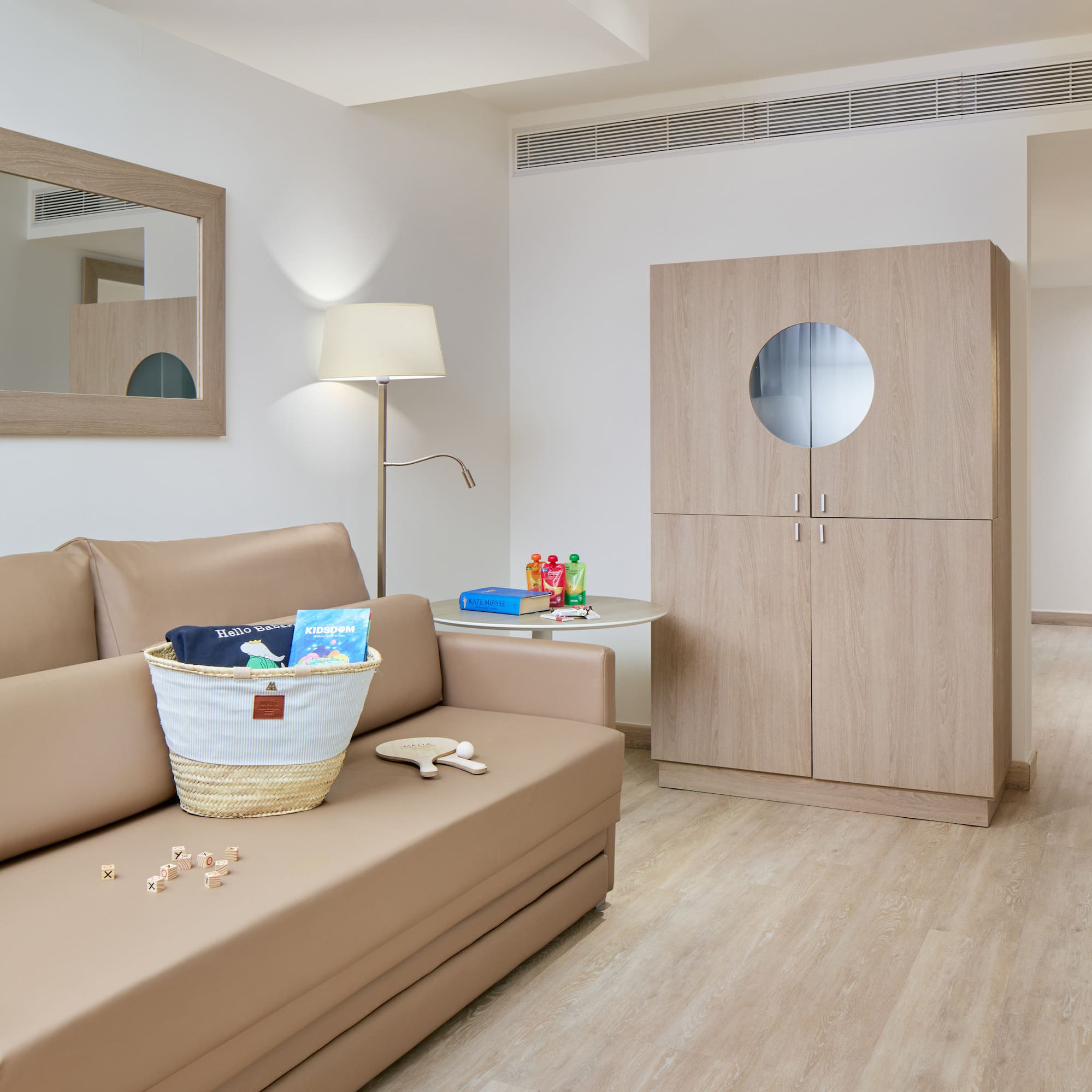 a room with a couch and a lamp