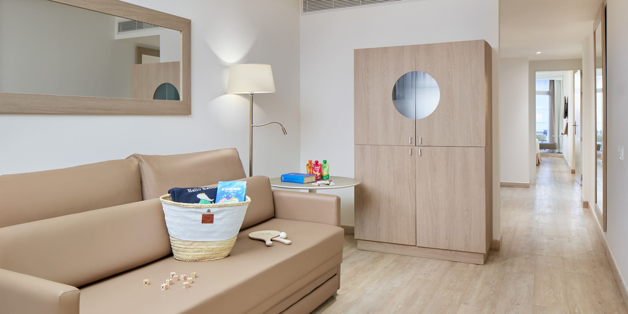 a room with a couch and a lamp