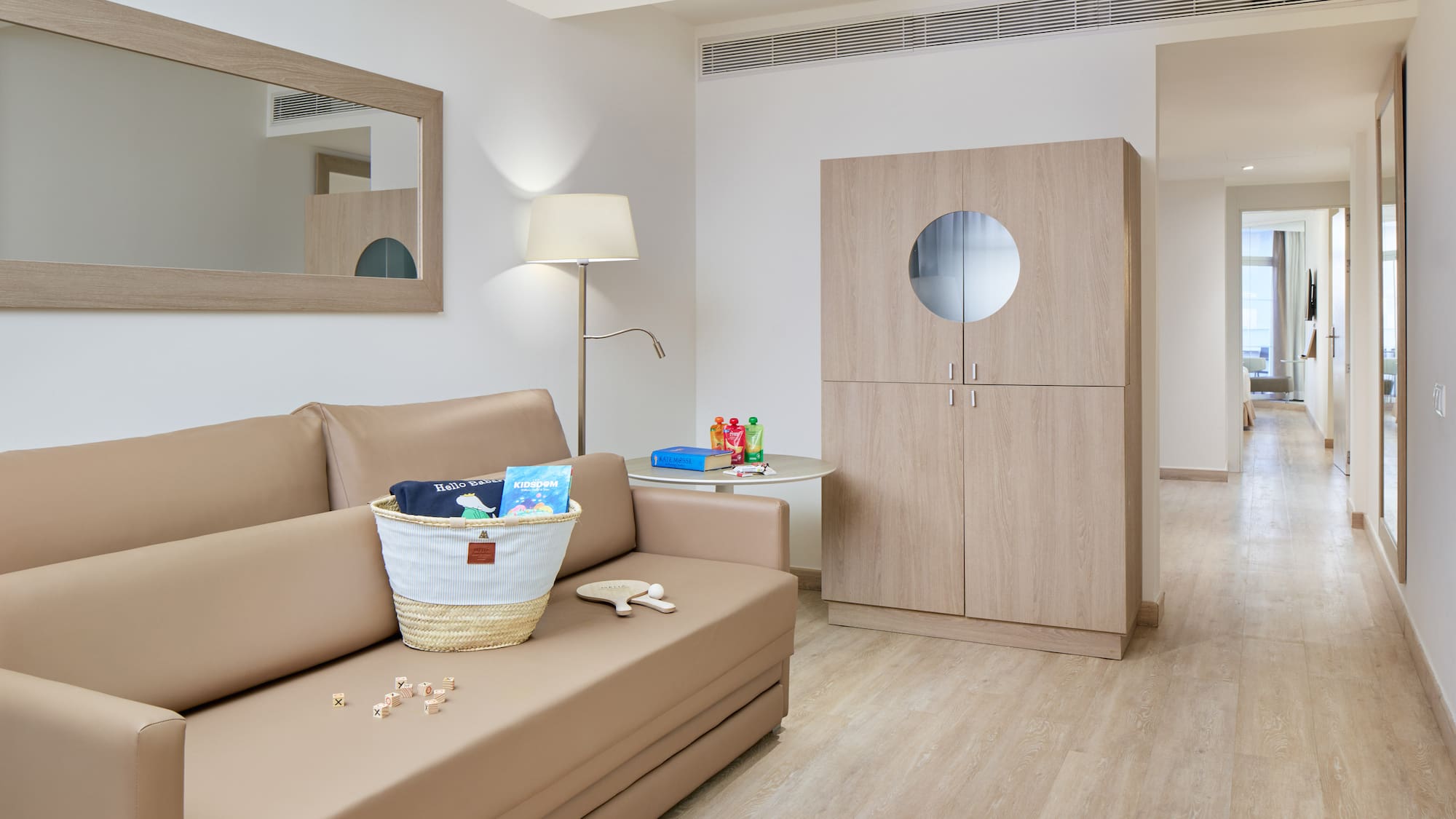 a room with a couch and a lamp