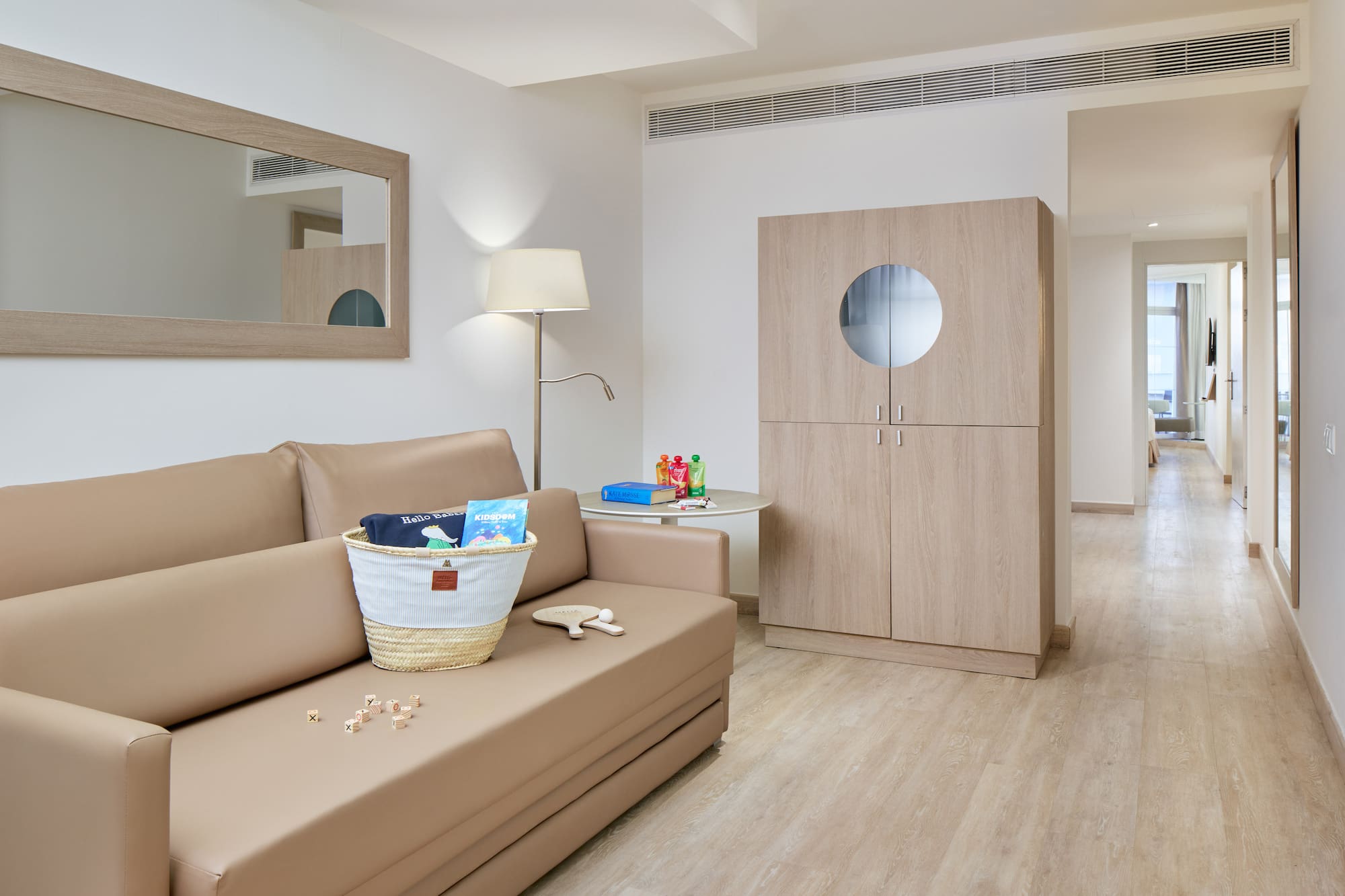 a room with a couch and a lamp