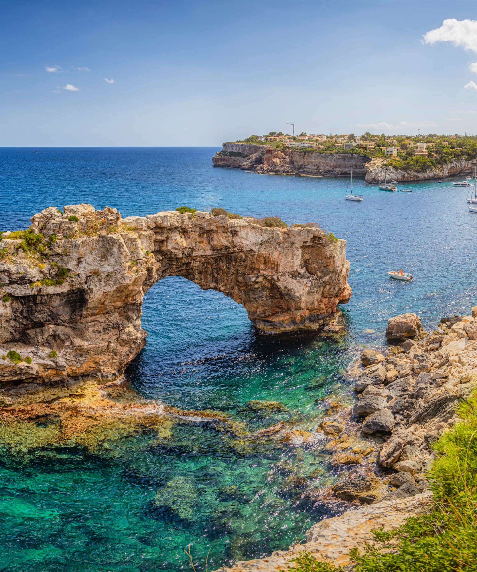 a rock arch in the water