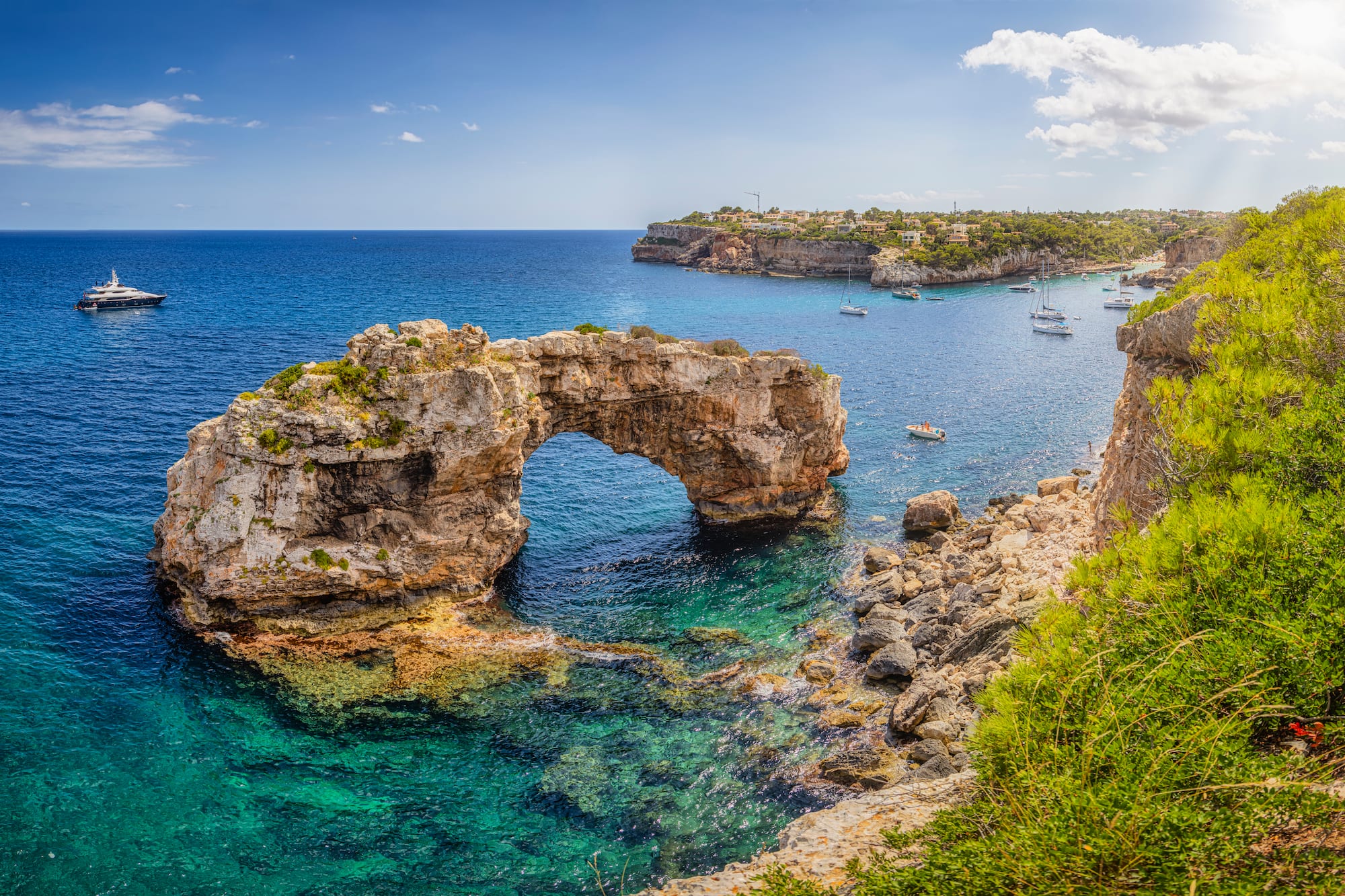 a rock arch in the water