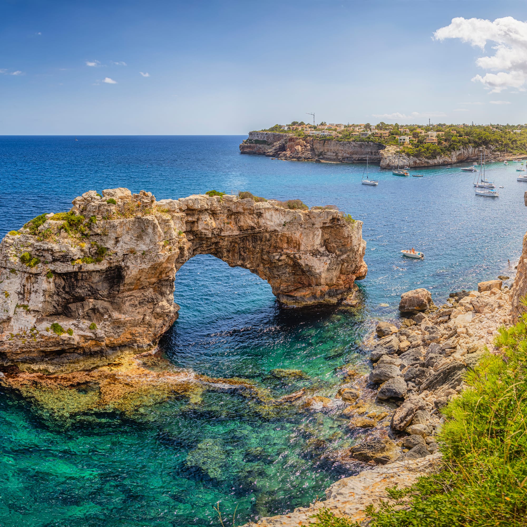 a rock arch in the water