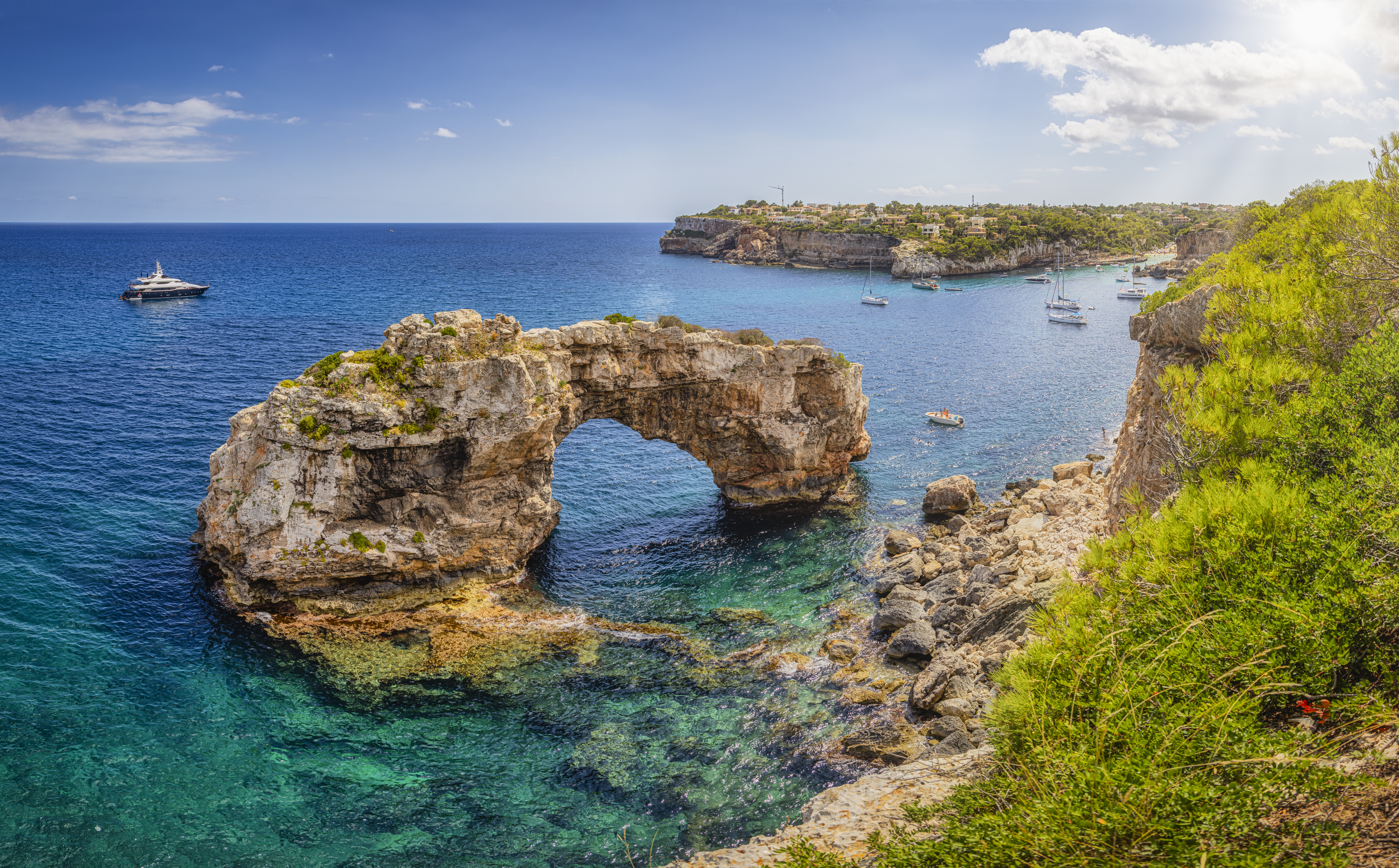 a rock arch in the water