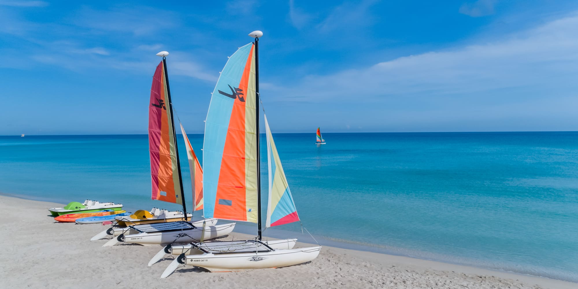sail boats on a beach