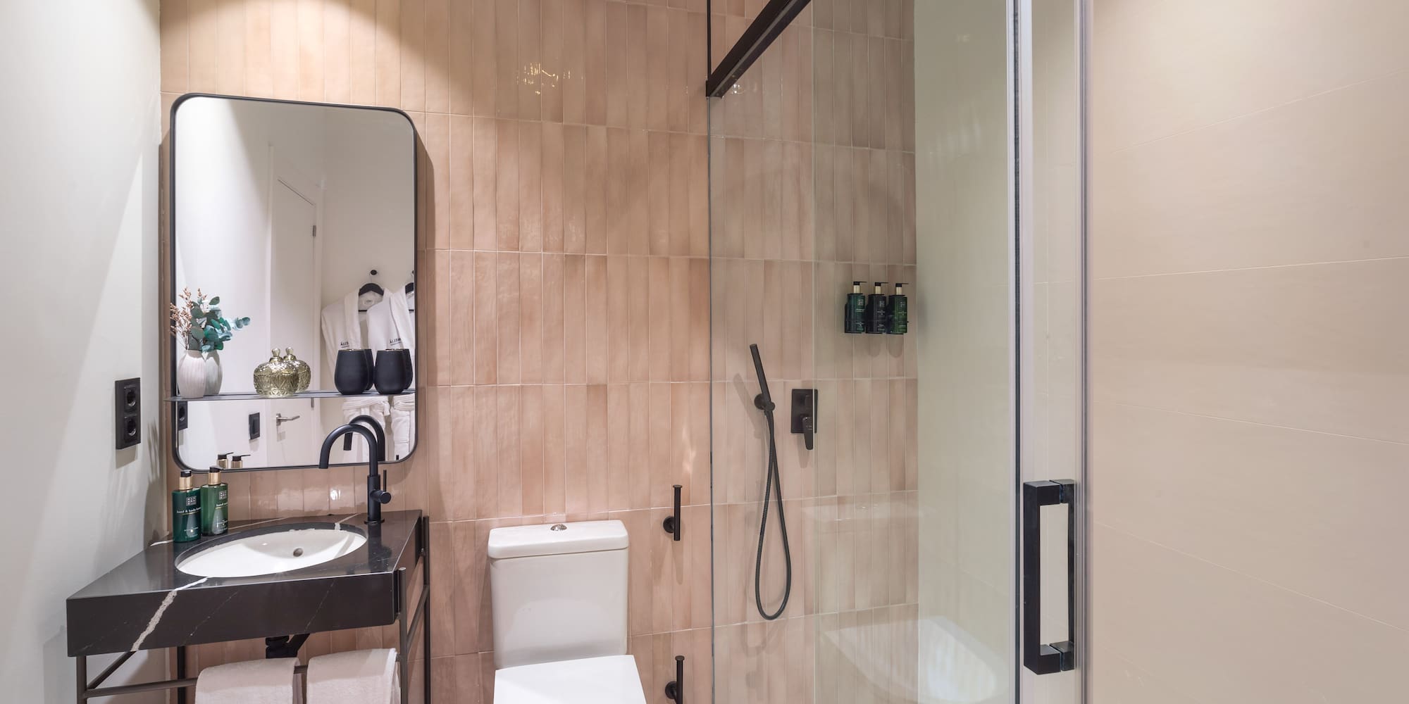 a bathroom with a shower and toilet