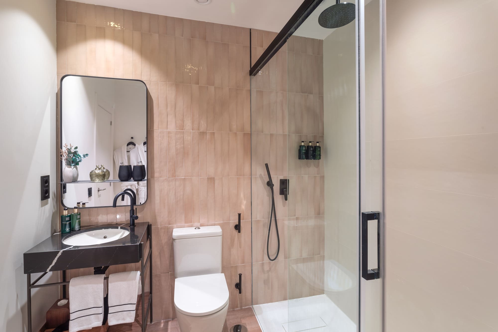 a bathroom with a shower and toilet