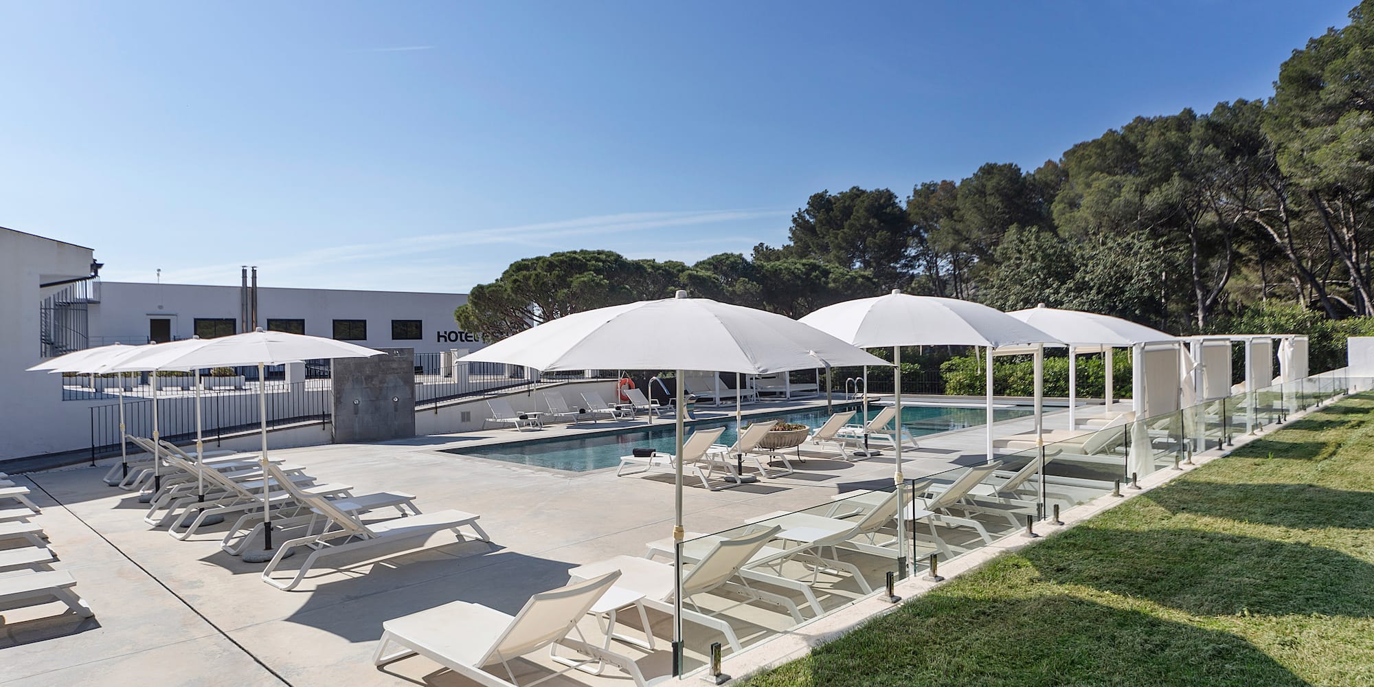 a pool with umbrellas and chairs