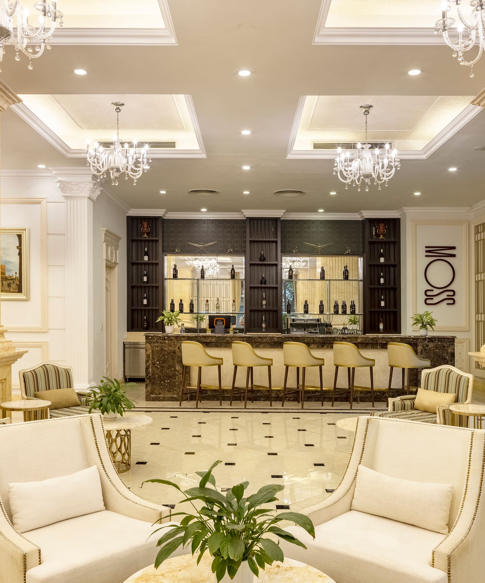 a room with white chairs and a table