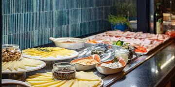 a buffet table with different food items on it