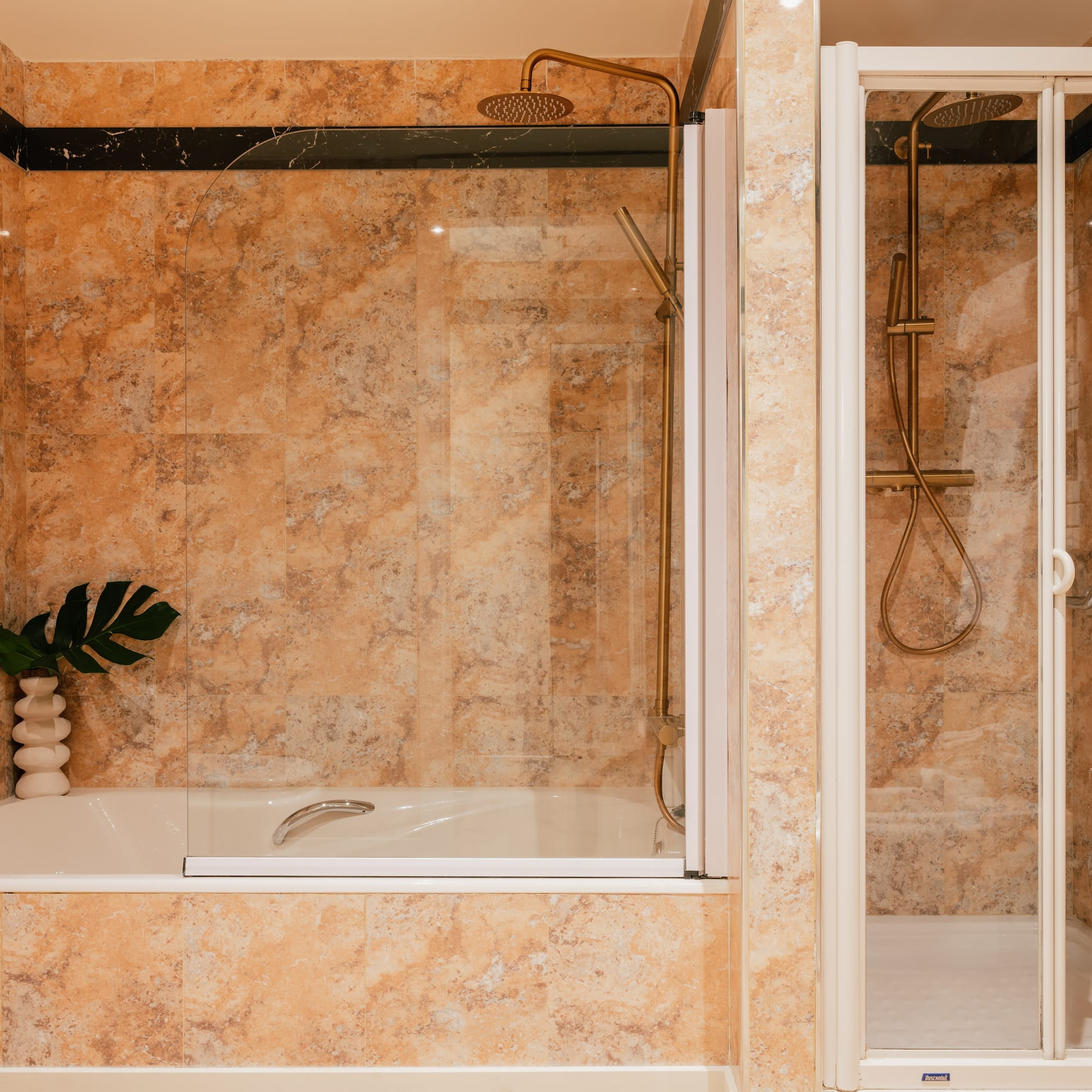 a shower and bathtub in a bathroom