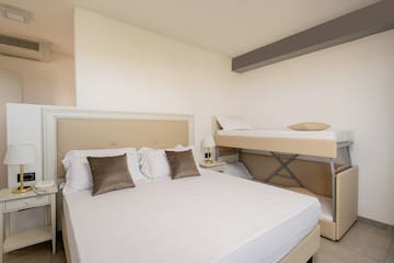 a bed with two bunk beds