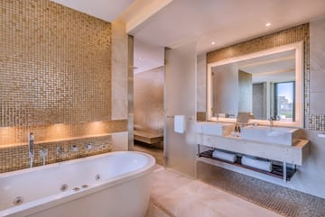 a bathroom with a tub and sink