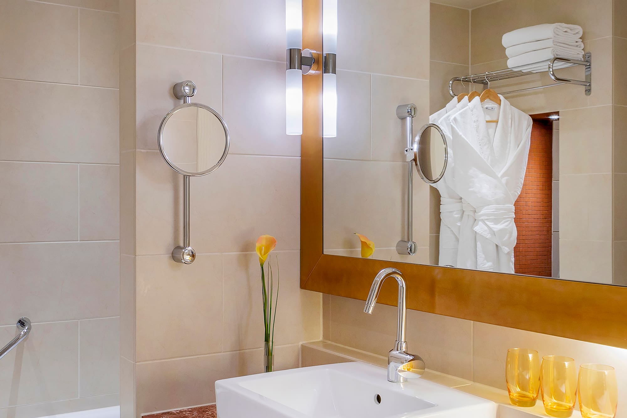 a bathroom with a mirror and sink