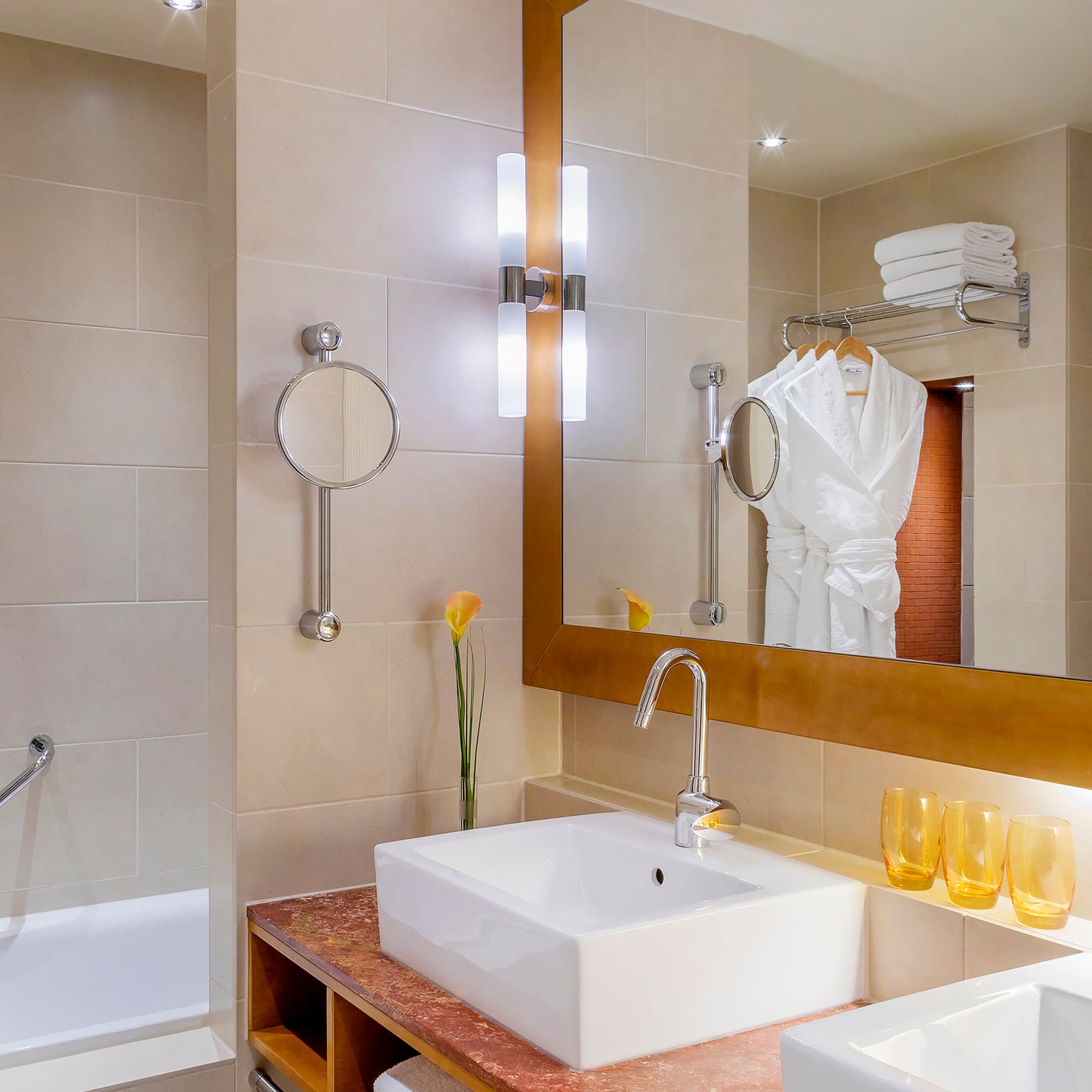 a bathroom with a mirror and sink