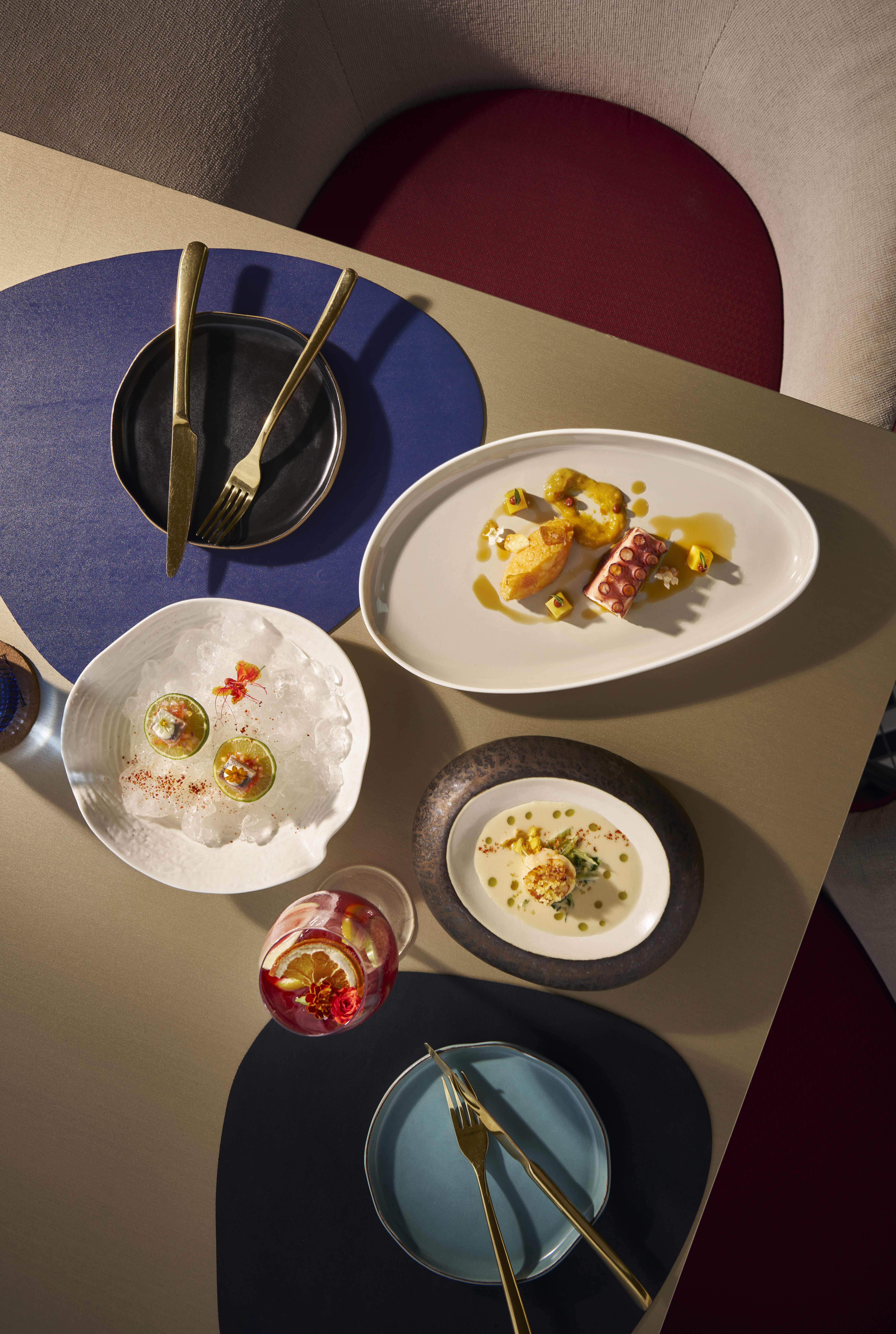 Gourmet seafood and cocktail on an elegant restaurant table.
