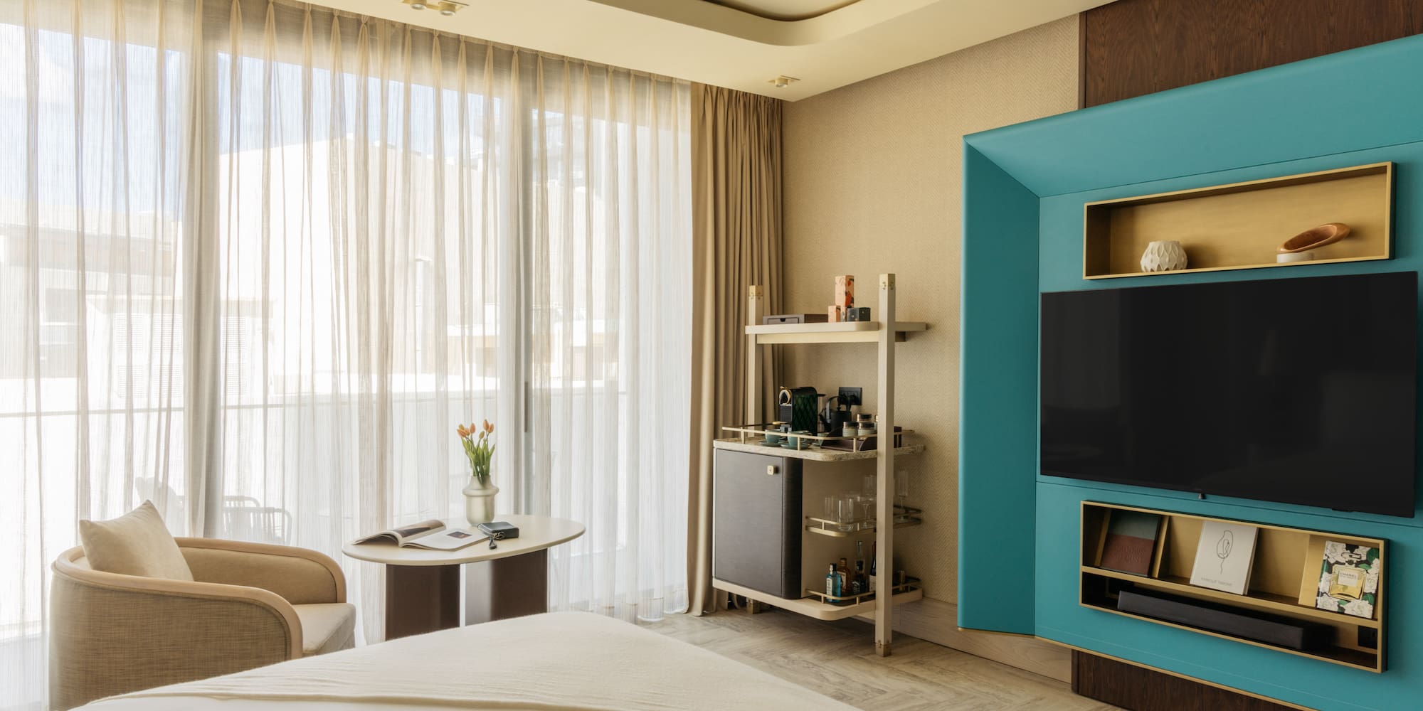 a room with a bed and a tv