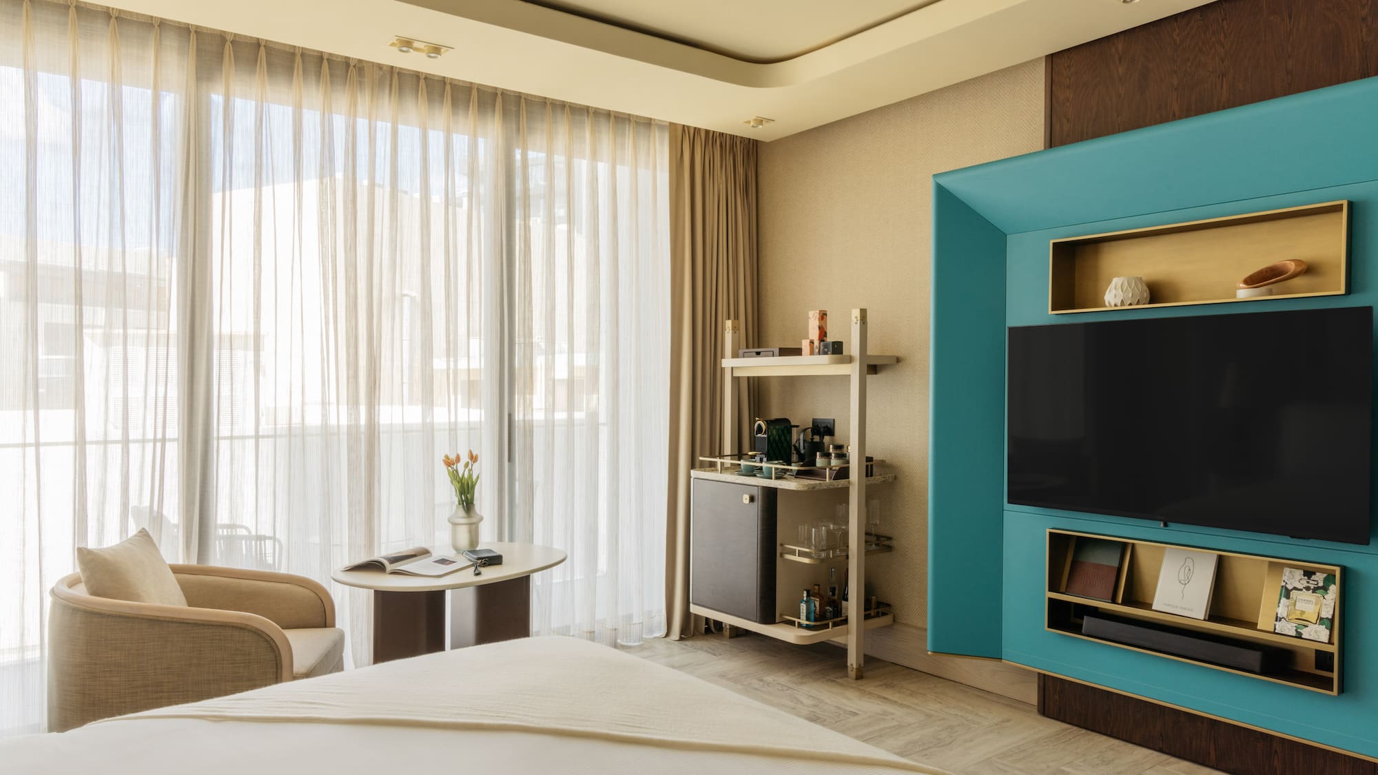 a room with a bed and a tv