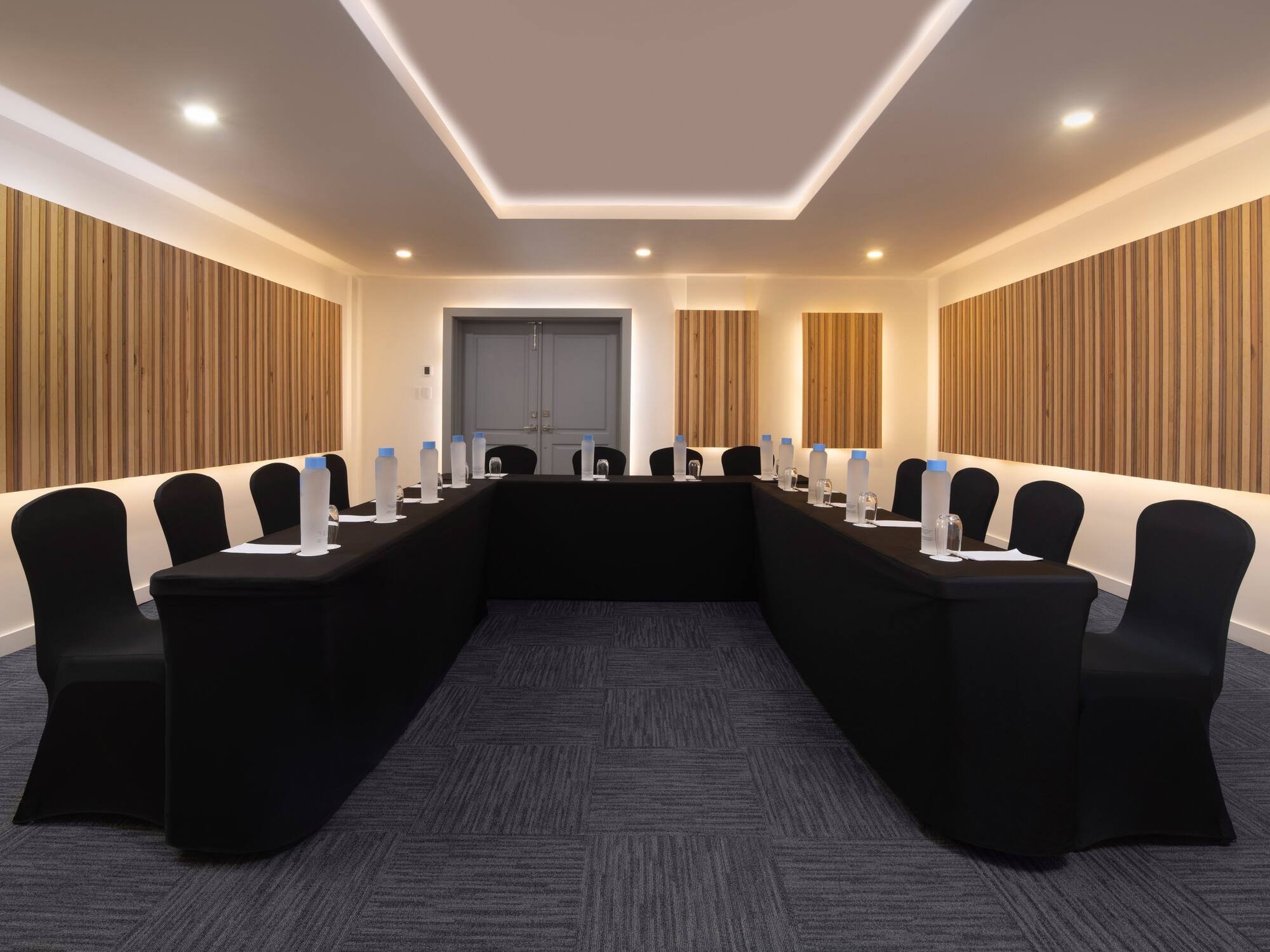 a room with black tables and chairs