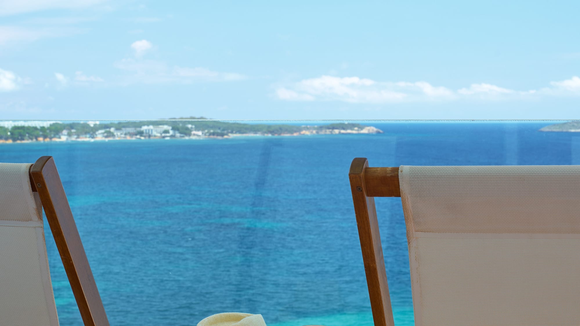 chairs and a table with a hat on it