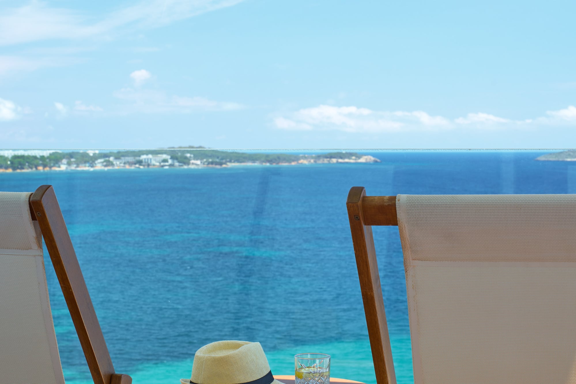 chairs and a table with a hat on it