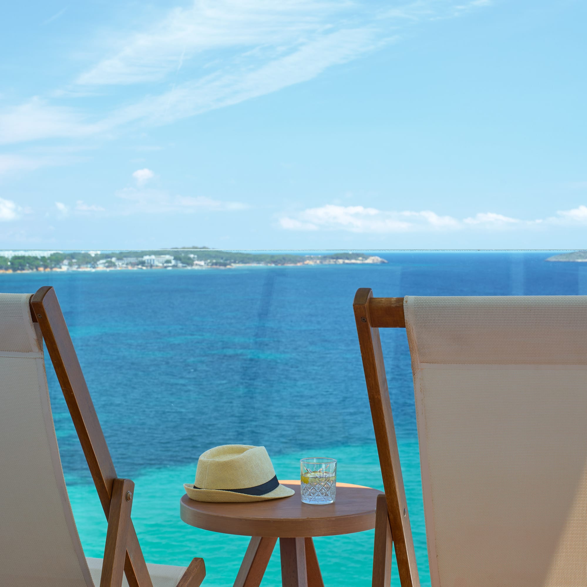 chairs and a table with a hat on it