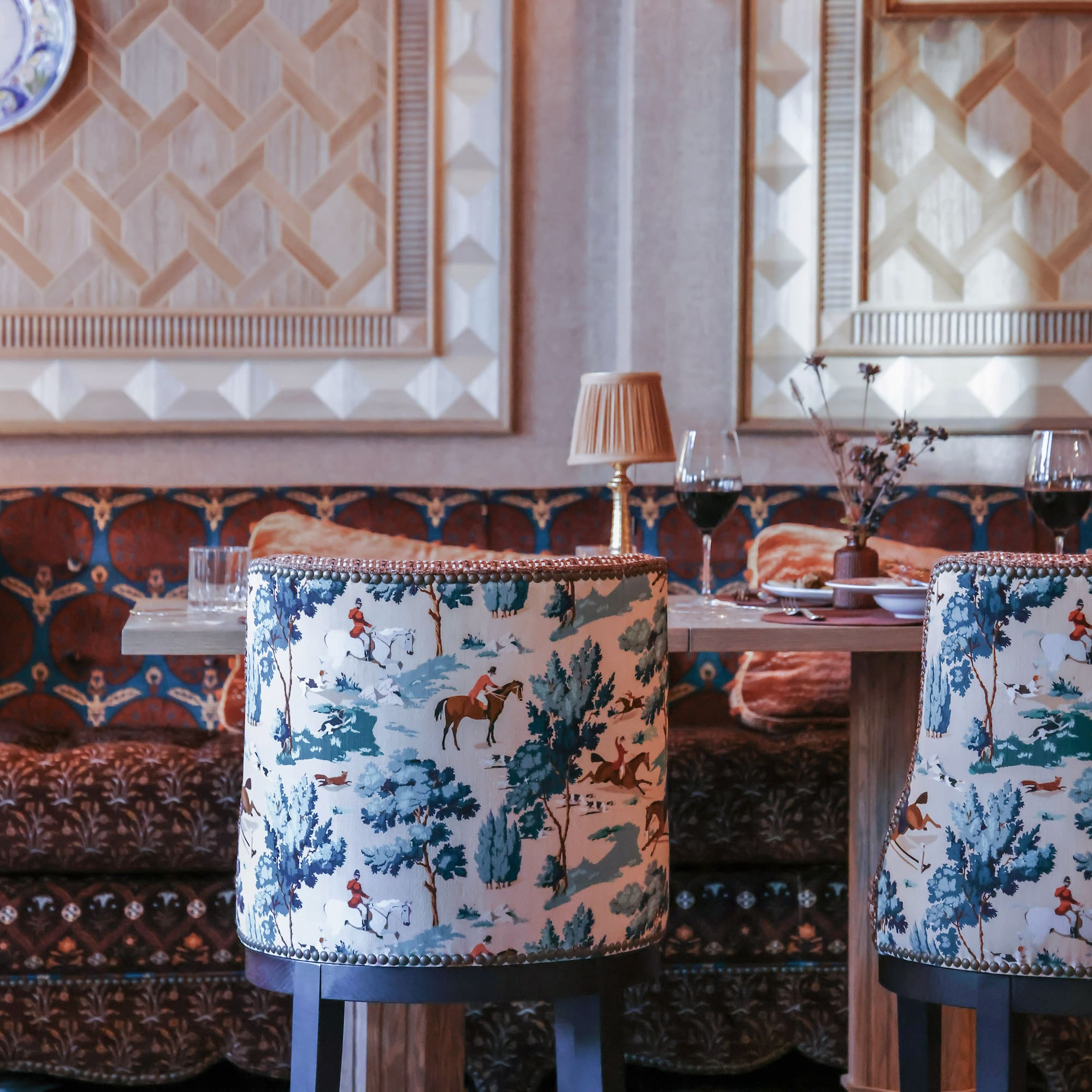 a table with chairs and a table with wine glasses