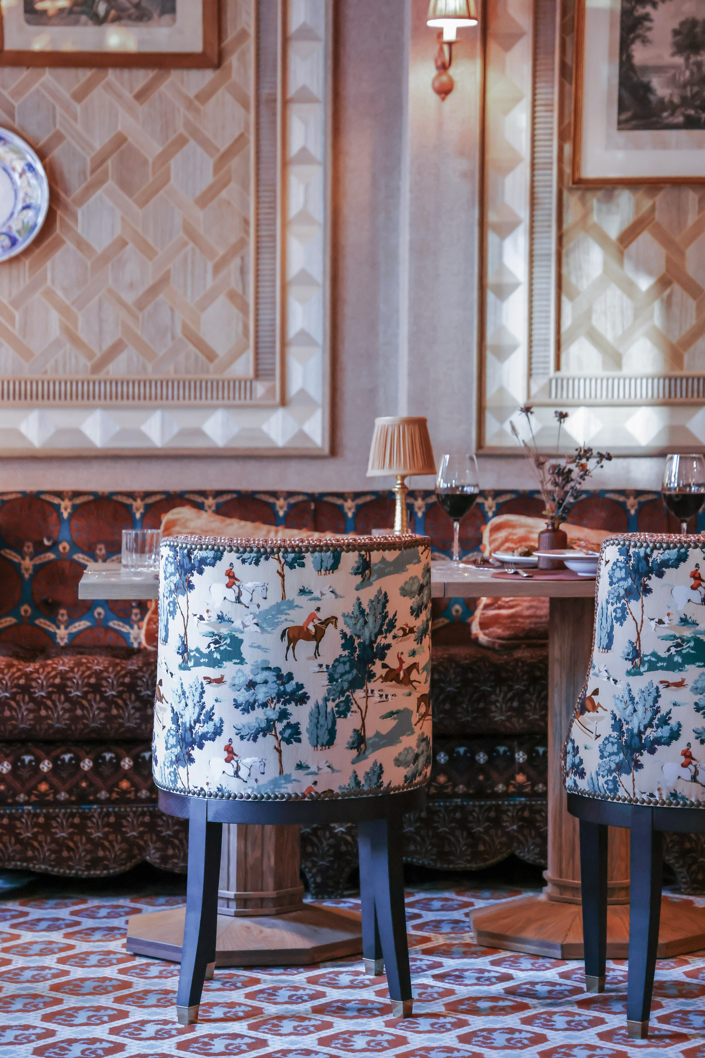 Equestrian toile pattern chairs in an elegant dining room.