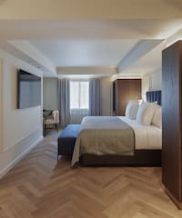 a room with a bed and a tv