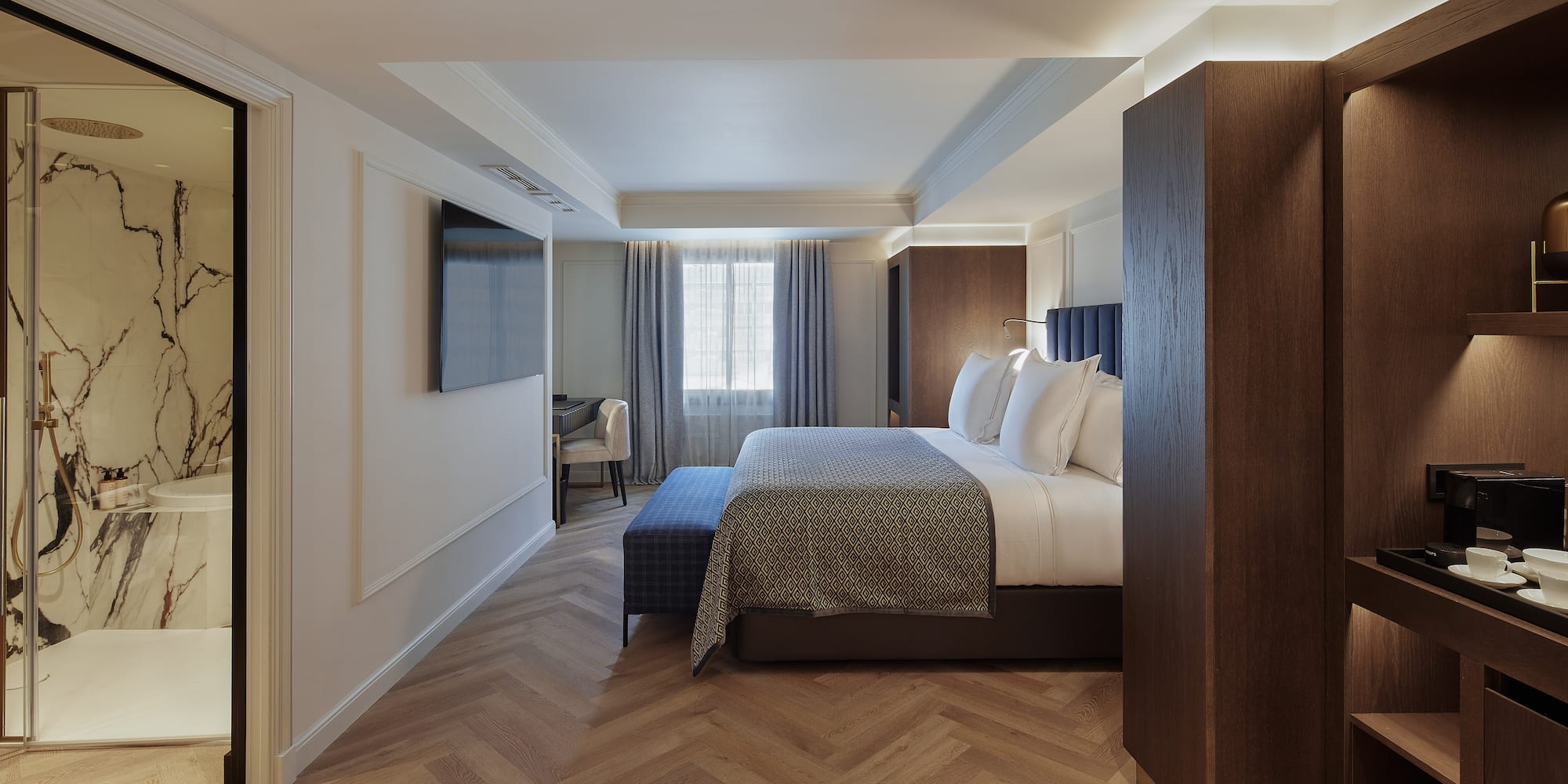 a room with a bed and a tv